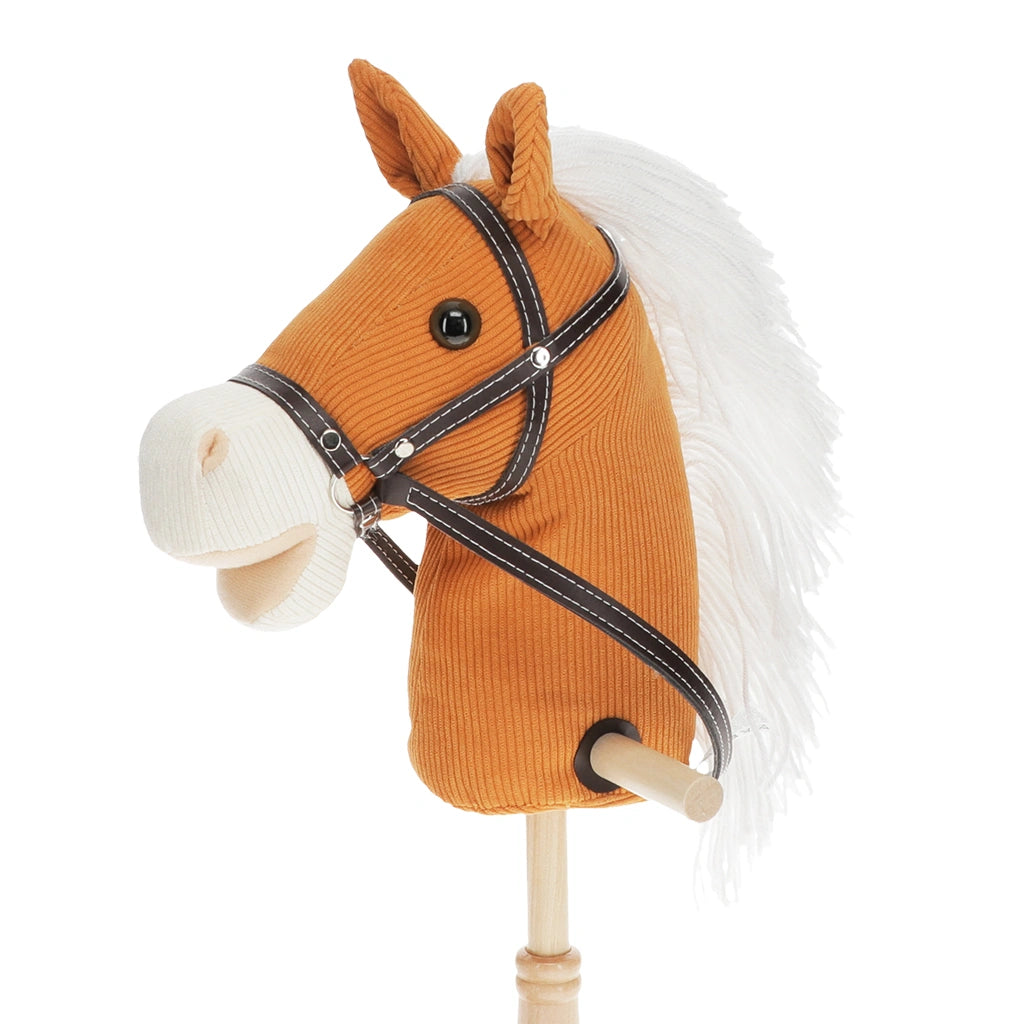 Brown horse head with bridle and white mane on a stick against a white background