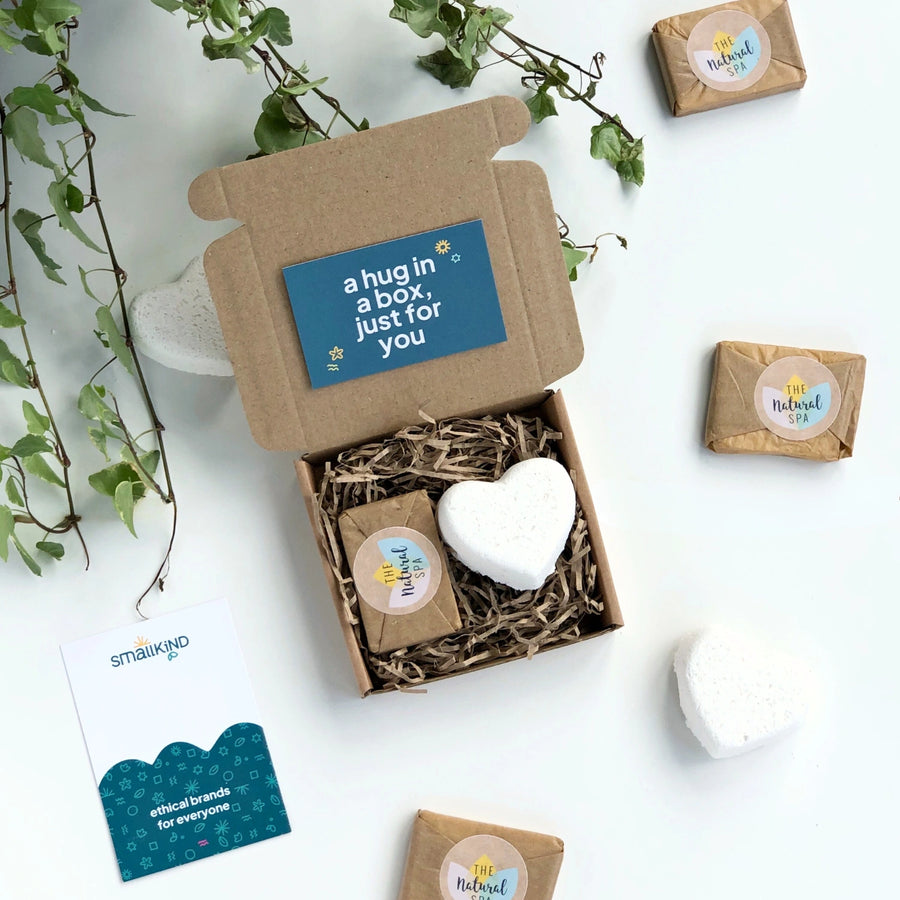 hug in a box mini gift set with a white natural bath bomb and a mini gift wrapped soap. The box includes a card which reads ' a hug in a box just for you'