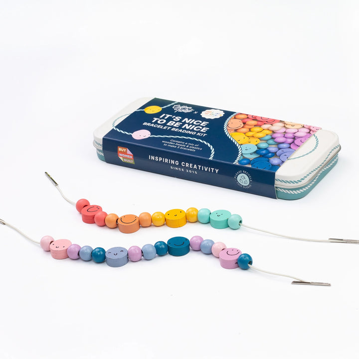 A beaded bracelet making kit shown with its blue zippered storage case and two completed pastel beaded bracelets on a white background.