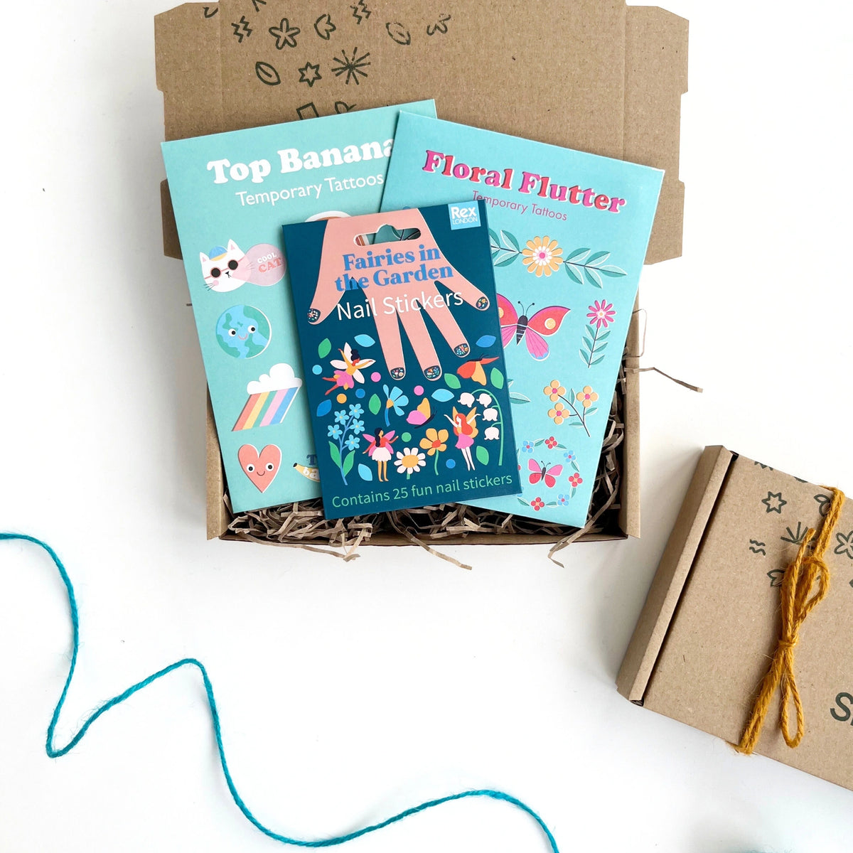 children's temporary tattoos and nail stickers with a flower and fairy theme in a kraft gift box. for kids age 3 and over. 