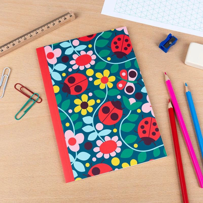 rex london ladybird notebook on a desk with pencils and stationery
