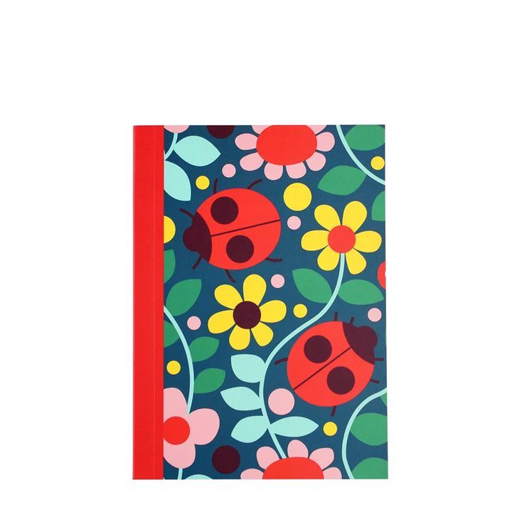 small notebook with ladybird and flower design on a white background