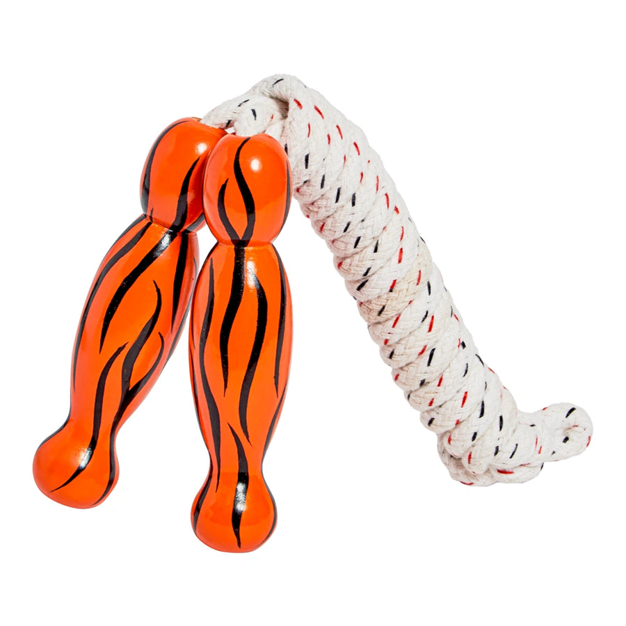 Orange and black striped skipping rope with a white rope on a white background