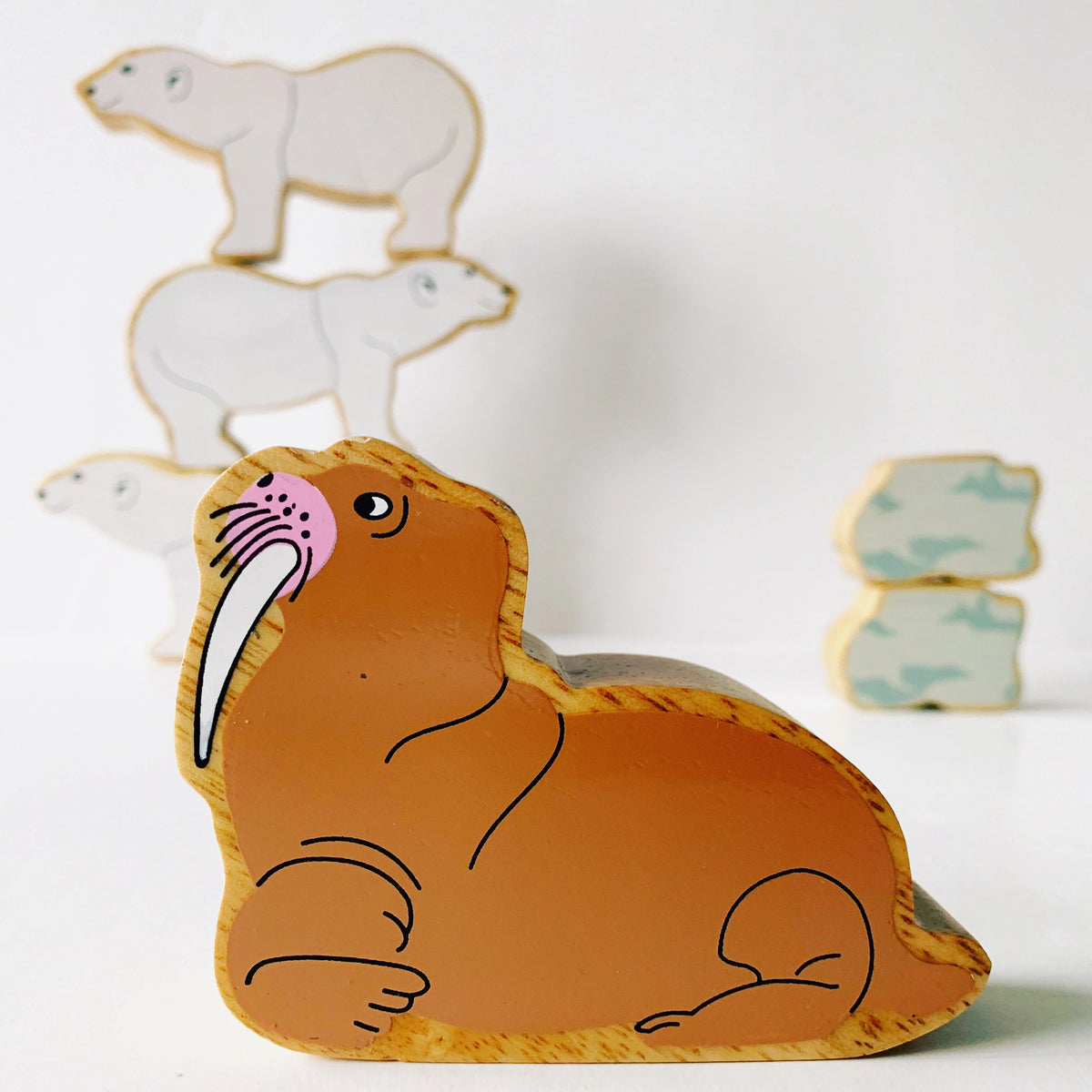 Lanka Kade Wooden Walrus play figures with polar bears and rock figures in the background