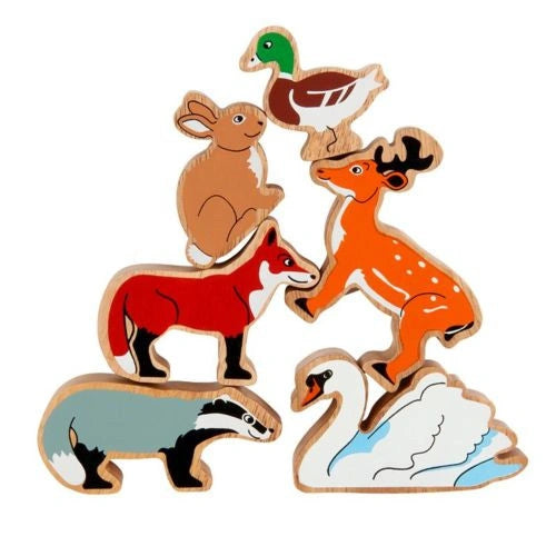 Set of wooden animal toys on a white background