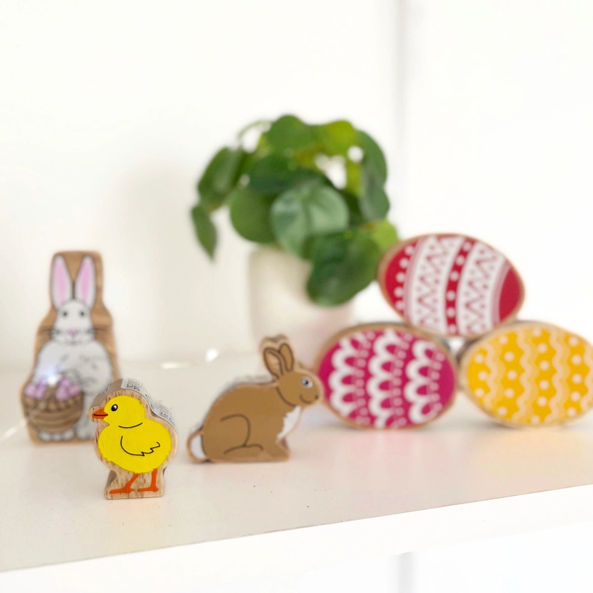 Lanka Kade Wooden Easter Bunny and Chick play figures on a shelf - natural wood toys for toddlers