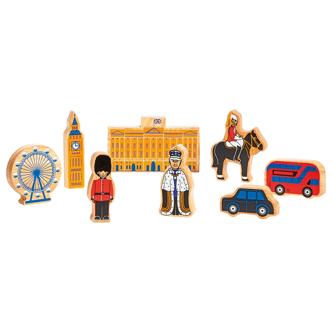 Set of wooden London-themed toys including Big Ben, a guard, a red bus, and a black taxi on a white background.