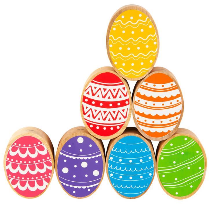wooden easter eggs play figures with colourful painted details and a natural wood grain edge. 