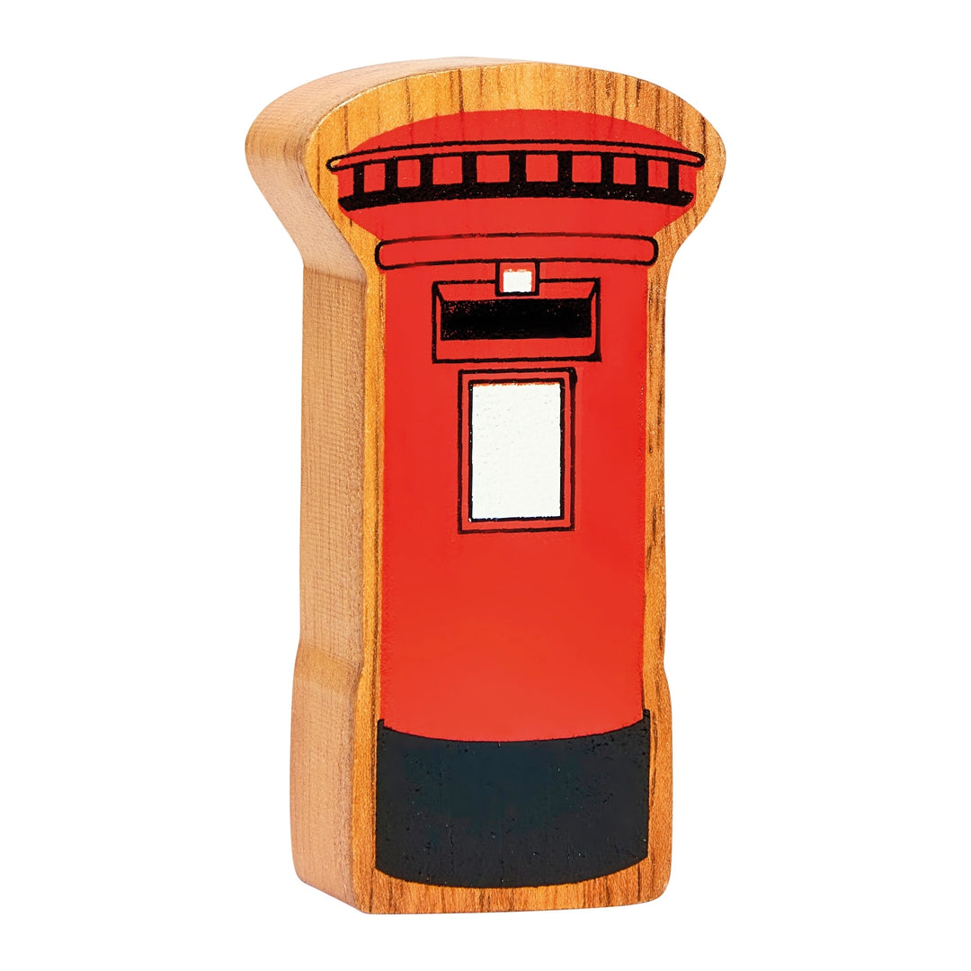 Wooden toy British post box on a white background