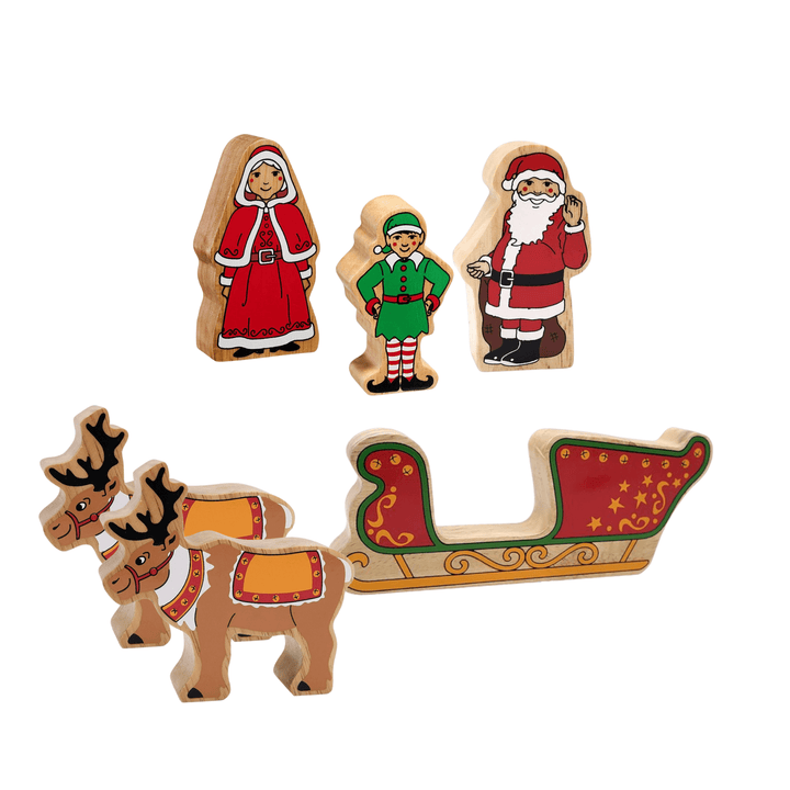 A set of colourful wooden Christmas playset figures including Santa Claus, Mrs. Claus, and two reindeer, along with a sleigh.