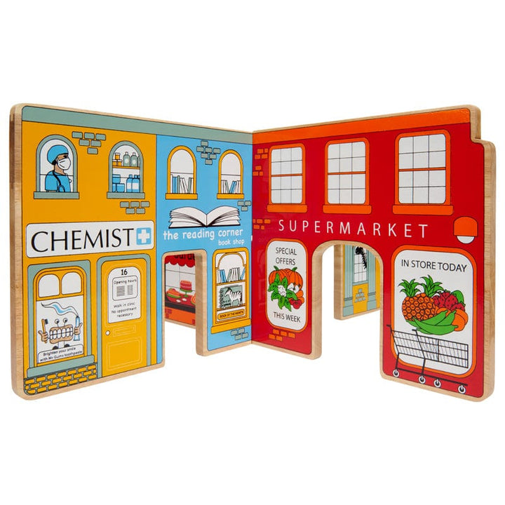 wooden toy world play scene with chemist, bookshop and supermarket