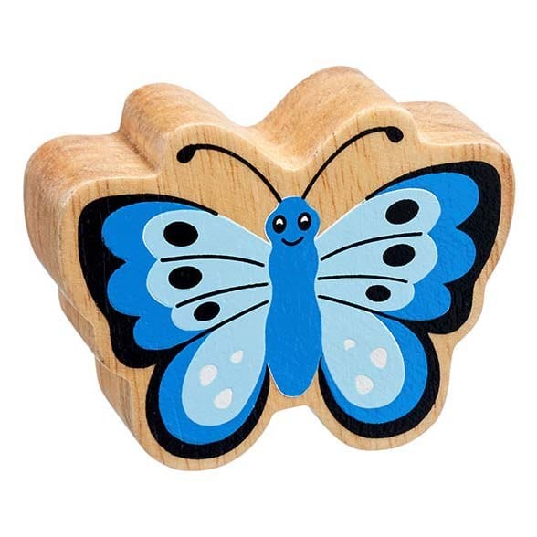 A wooden play figure shaped like a blue butterfly with a natural wood grain edge and a smile on its face.