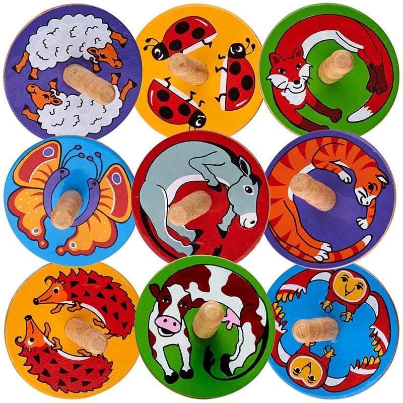 A collection of colorful wooden spinning tops with various animal illustrations, including a ladybug, a cat, a fox, and others.