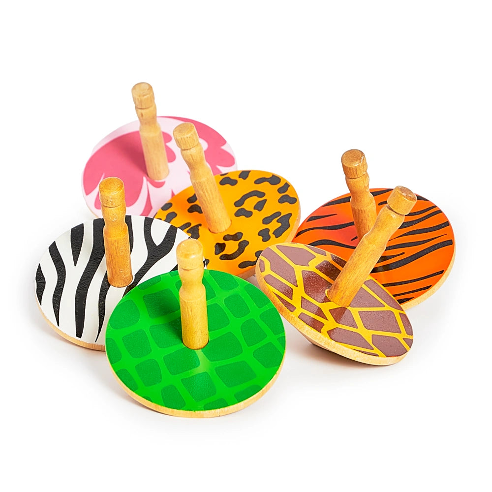 Set of five animal print wooden spinning top toys on a white background