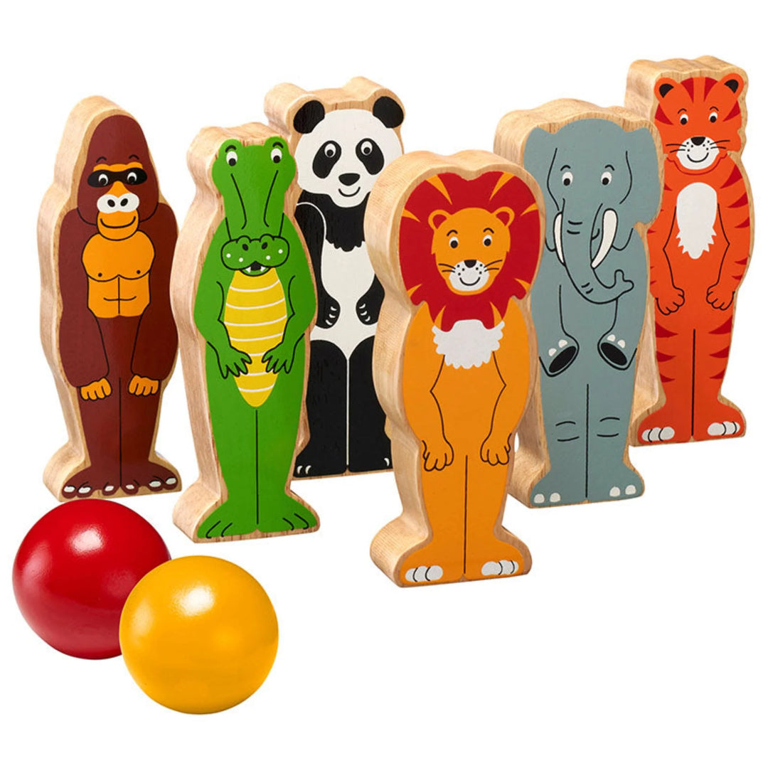 Set of six wooden animal shaped skittles including gorilla, crocodile, panda, lion, elephant and tiger - with two wooden balls on a white background
