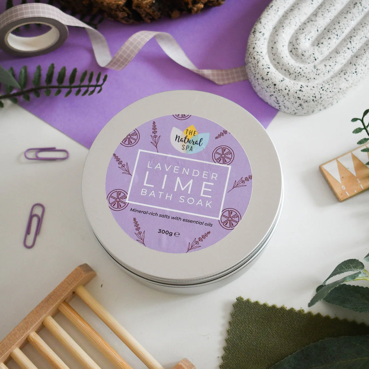 Lavender Lime bath soap container with decorative elements on a white surface