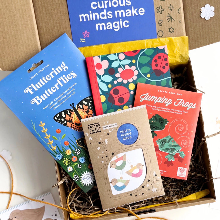 children's nature themed craft activities  in s gift box with a 'curious minds make magic' card.