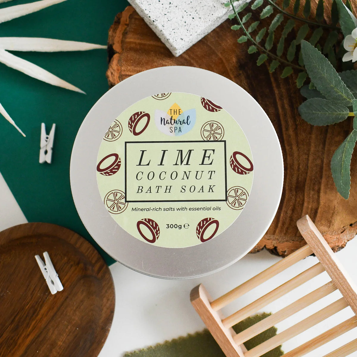Lime Coconut Bath Soak container with decorative elements on a wooden surface
