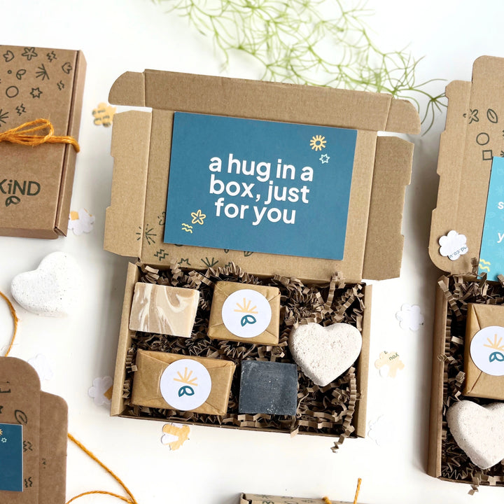Pamper Gift Box with 'a hug in a box, just for you' message and eco soap bars on a white background