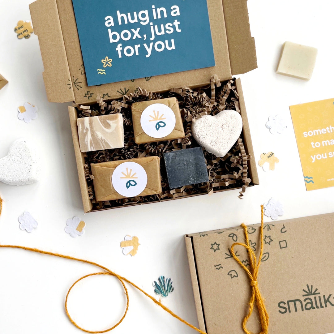 Pamper Gift Box with soaps and a heart-shaped bath bomb, featuring 'a hug in a box, just for you' card for a gift message.