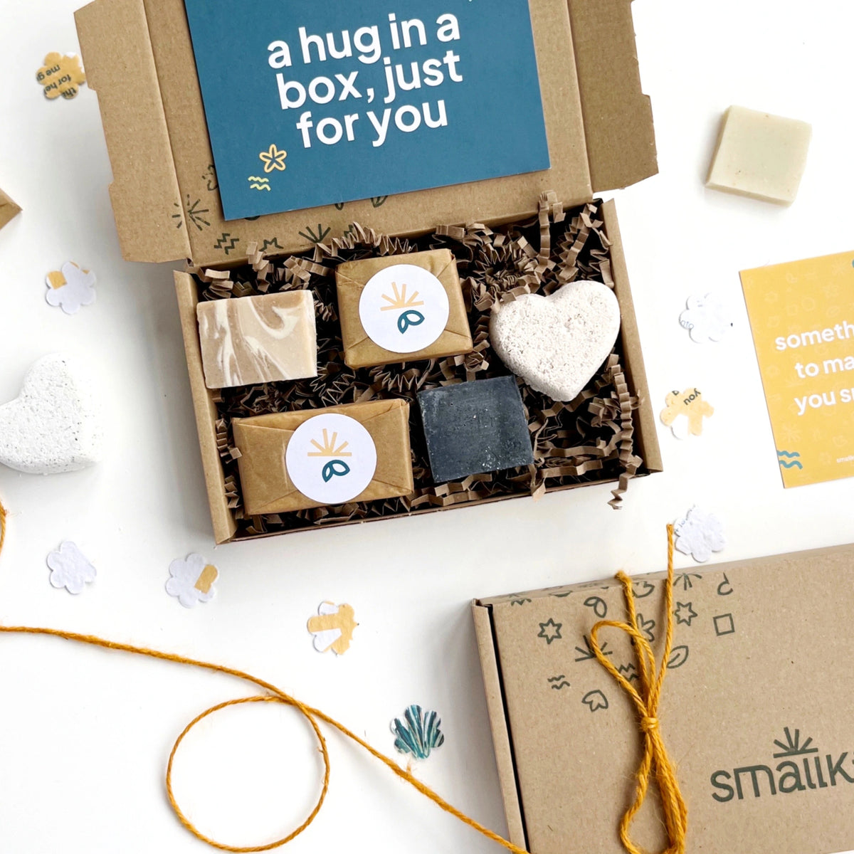Pamper Gift Box with soaps and a heart-shaped bath bomb, featuring 'a hug in a box, just for you' card for a gift message.