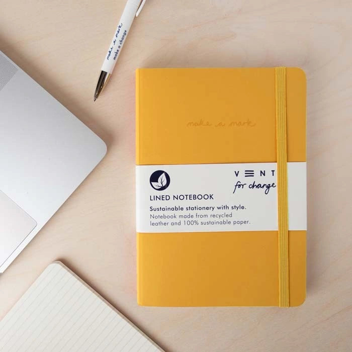 bright yellow recycled leather notebook by vent for change with an elasticated closure