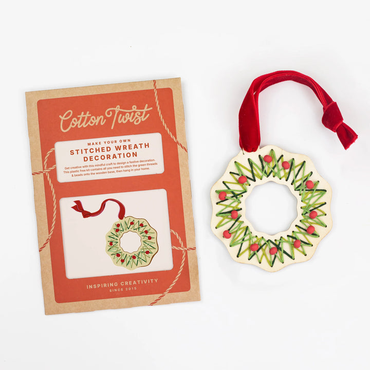 Cotton Twist make your own stitched wreath decoration kit with a completed wreath ornament on a white background