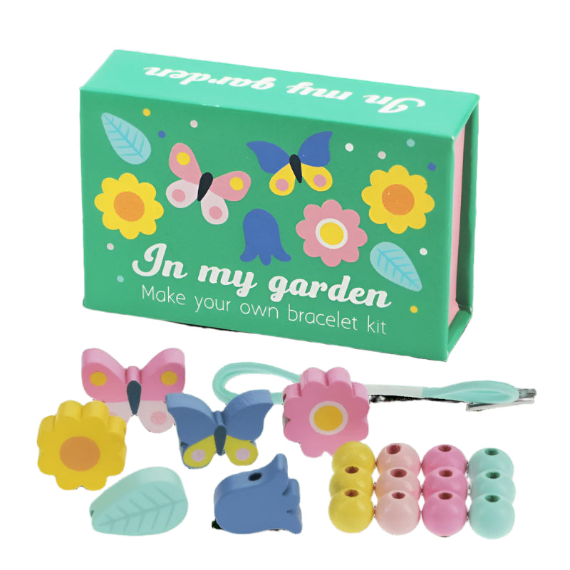 In My Garden Wooden Bead Bracelet Making Kit by Rex London. Featuring butterfly, flower and leaf beads with elasticated cord. Gif boxed.