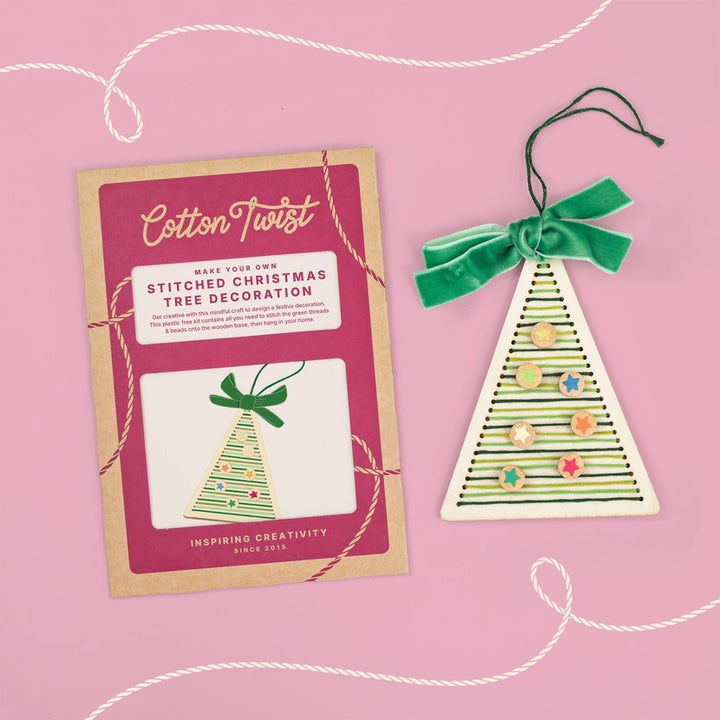 Cotton Twist stitched Christmas tree decoration kit on a pink background