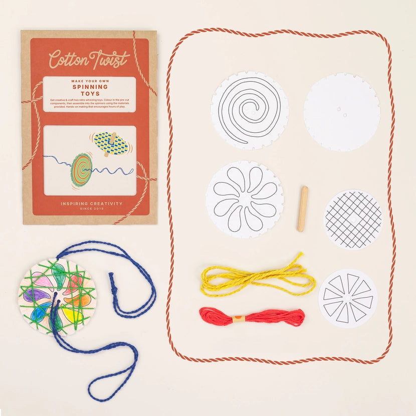Cotton Twist spinning toys kit with colourful yarn and templates on a beige background