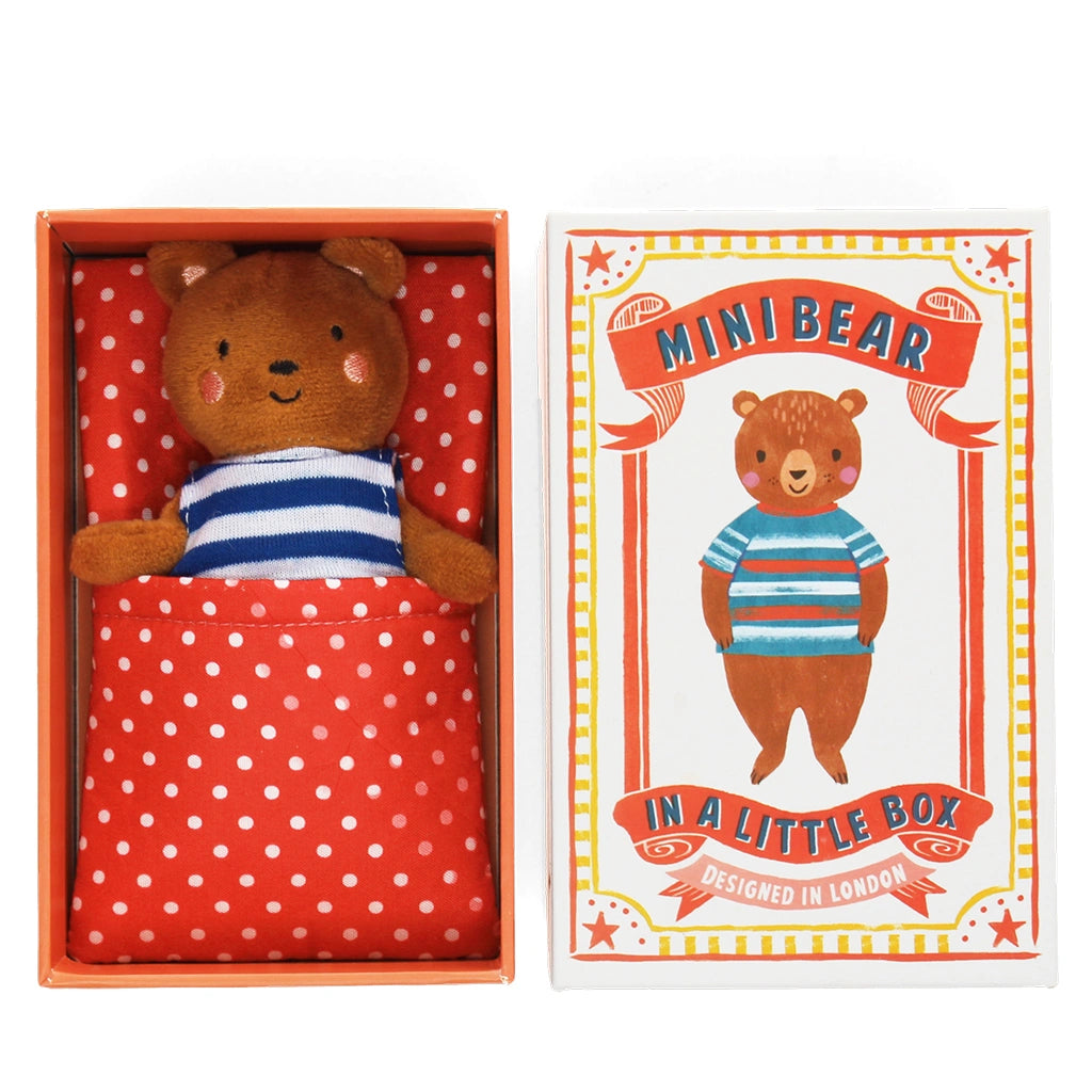 Stuffed bear toy in a red box with a matching polka dot fabric bed, accompanied by a decorative gift box featuring the bear design.