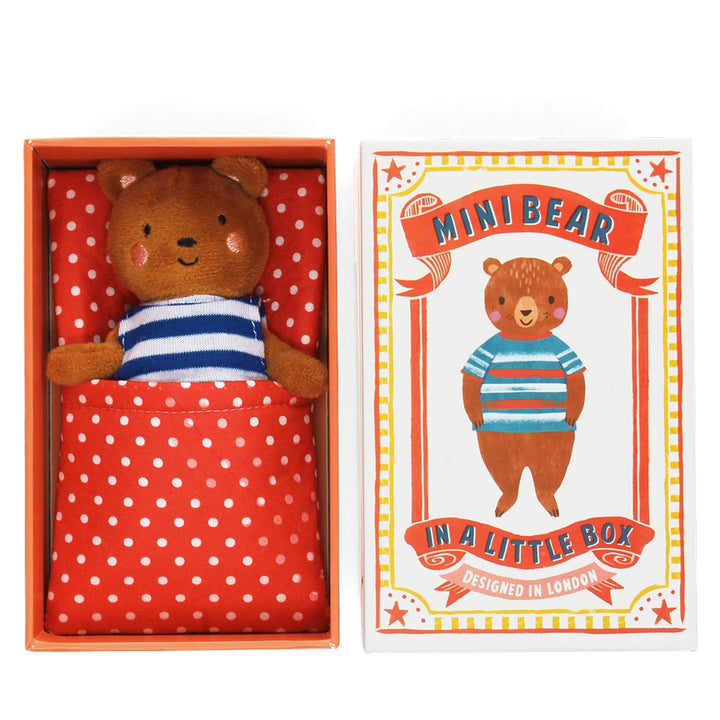 Stuffed bear toy in a red box with a matching polka dot fabric bed, accompanied by a decorative gift box featuring the bear design.