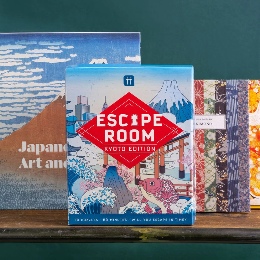 Escape Room Kyoto Edition puzzle box with Japanese-themed artwork on a wooden surface.
