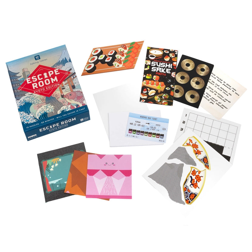 Collection of items including an 'Escape Room' book, cards, and a sushi-themed game on a white background
