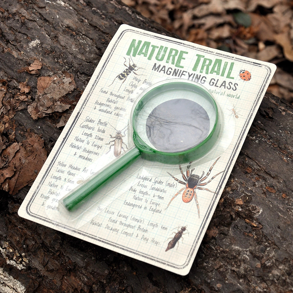 Rex London Nature Trail Magnifying Glass in nature inspired packaging on top of a tree log. Age 3+