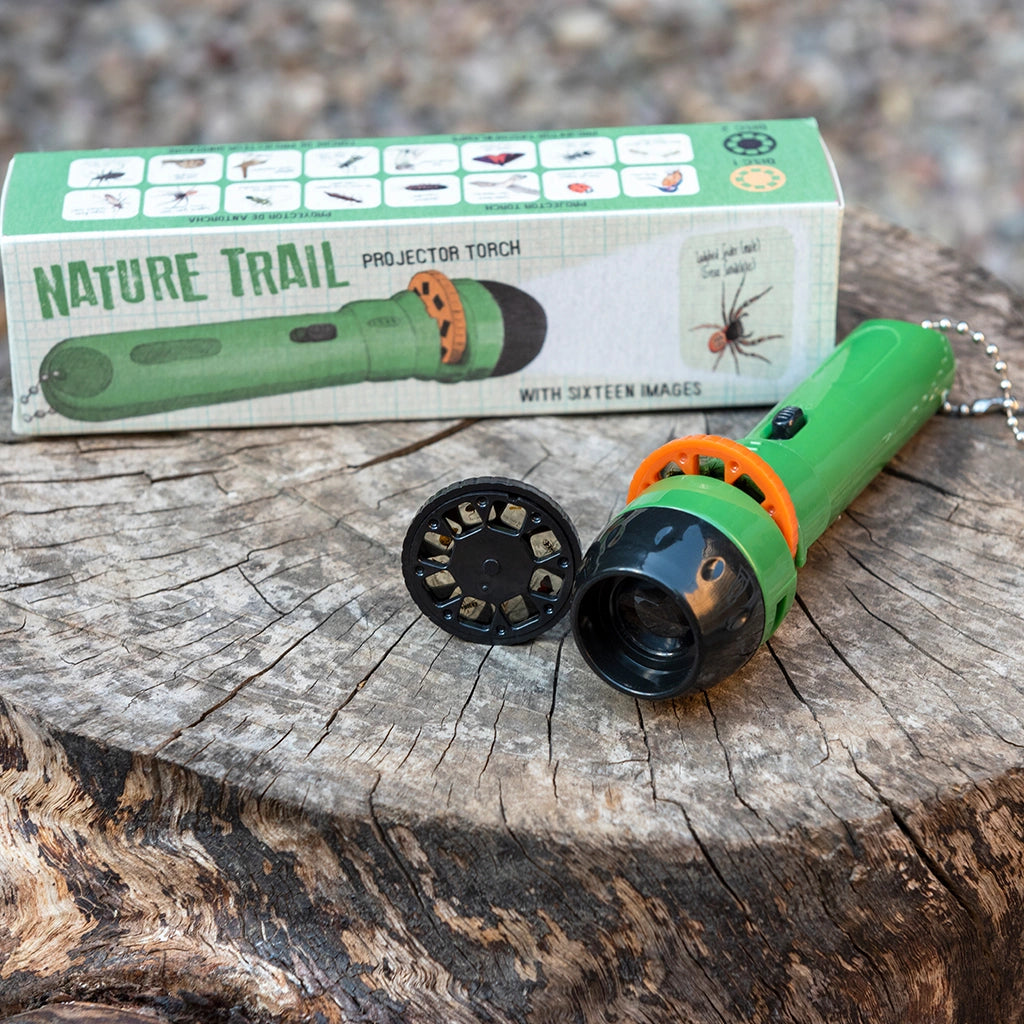 See the Nature Trail Projector Torch by Rex London up close! Image shows the green torch, packaging, and image disc with insect projections.