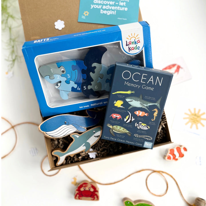 Educational toys and games for children, including a puzzle and memory game, on a white background.