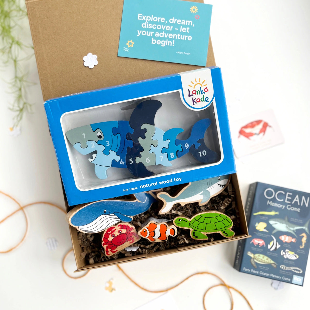 ocean themed kids gift box with shark wooden puzzle, wooden ocean figures and an ocean life memory game