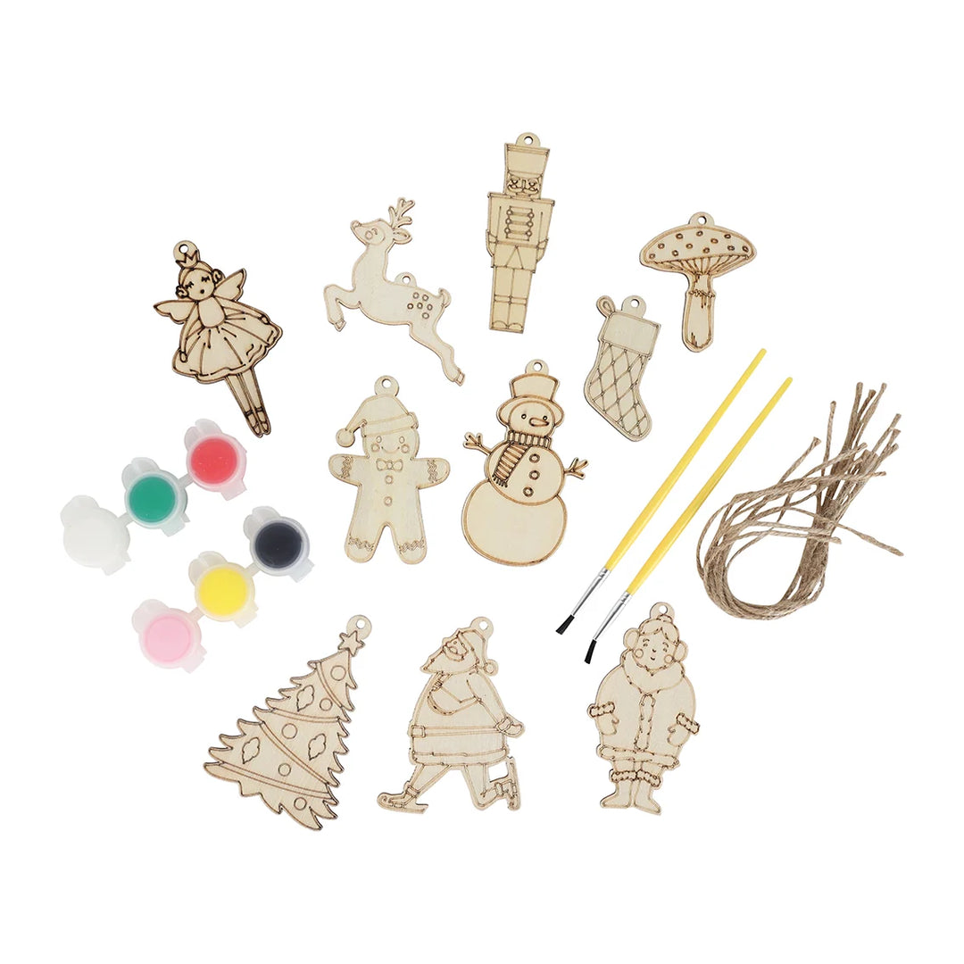 Set of wooden Christmas ornaments with paint and brush on a white background