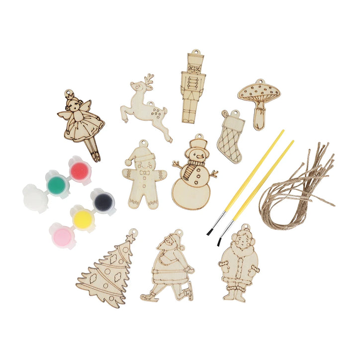 Set of wooden Christmas ornaments with paint and brush on a white background