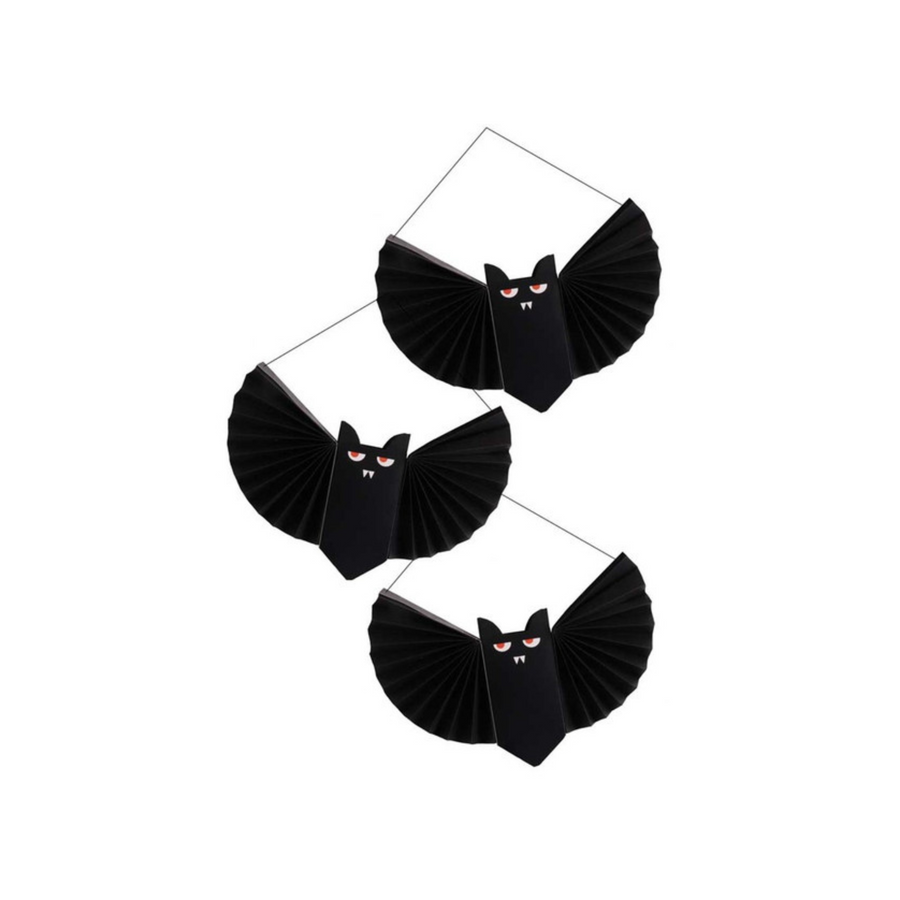 3 hanging paper bat decorations with cute faces for halloween decor.