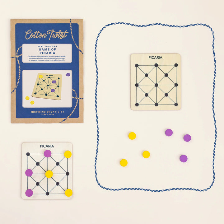 Cotton Twist Picaria game set with colourful game pieces and packaging on a light beige background