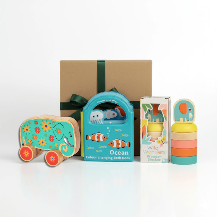 Collection of children's toys and books on a white background