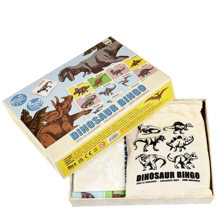 Dinosaur bingo game set with box, cards, and bags on a white background