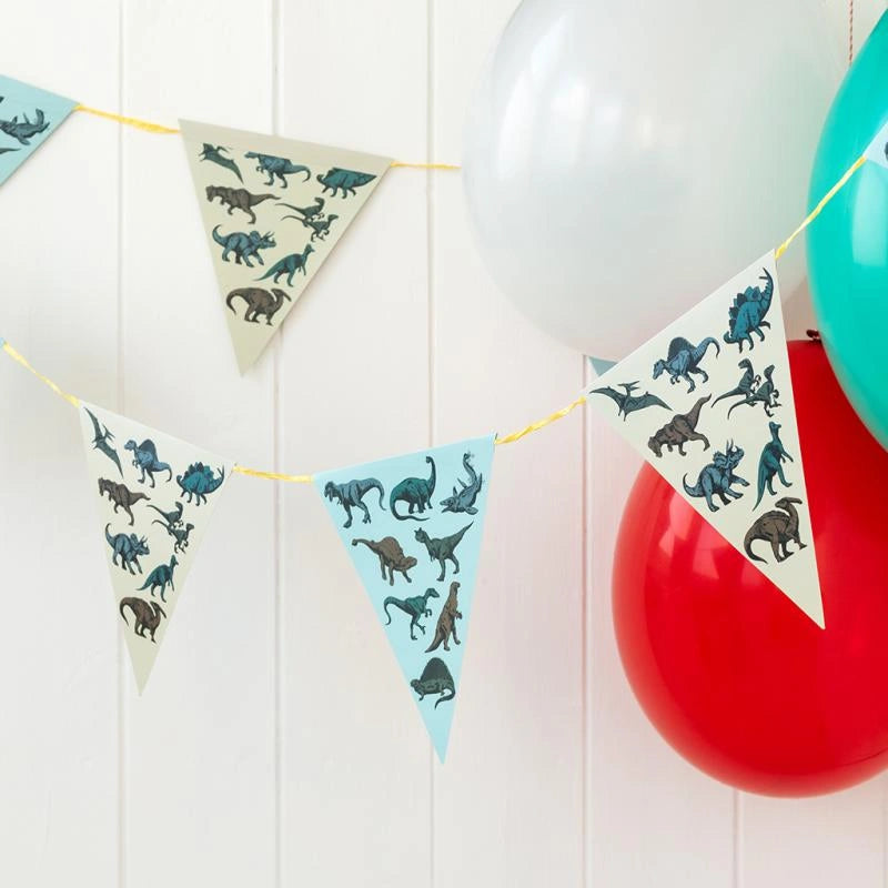 Prehistoric Land Dinosaur Party Bunting hung up with colourful balloons 