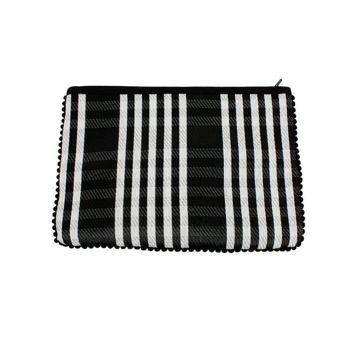 black and white checked pouch with a black zip and pom pom trim around the edges. Made from recycled cement sacks. 