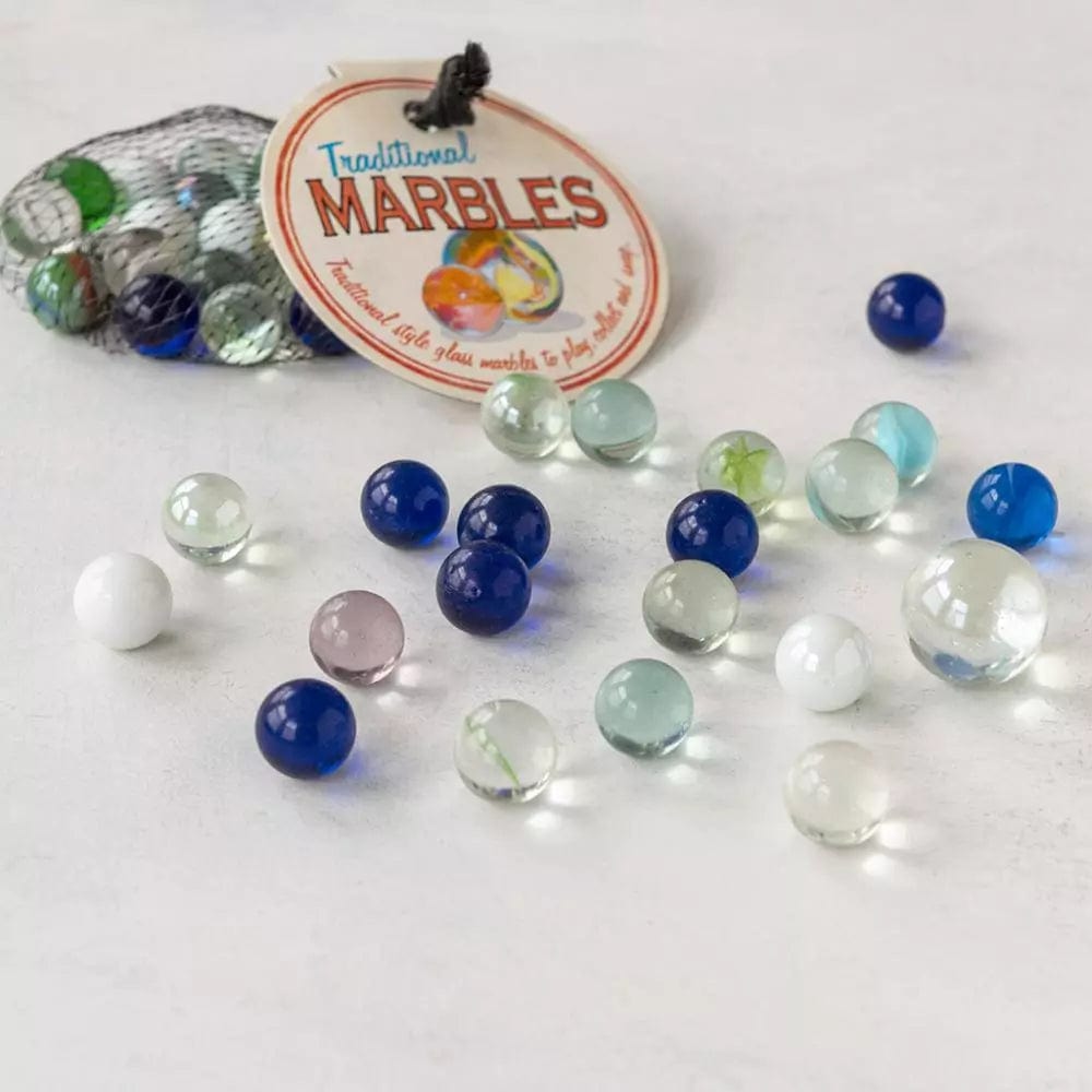 collection of coloured glass marbles pictures alongside a net with a label which reads 'traditional marbles' 