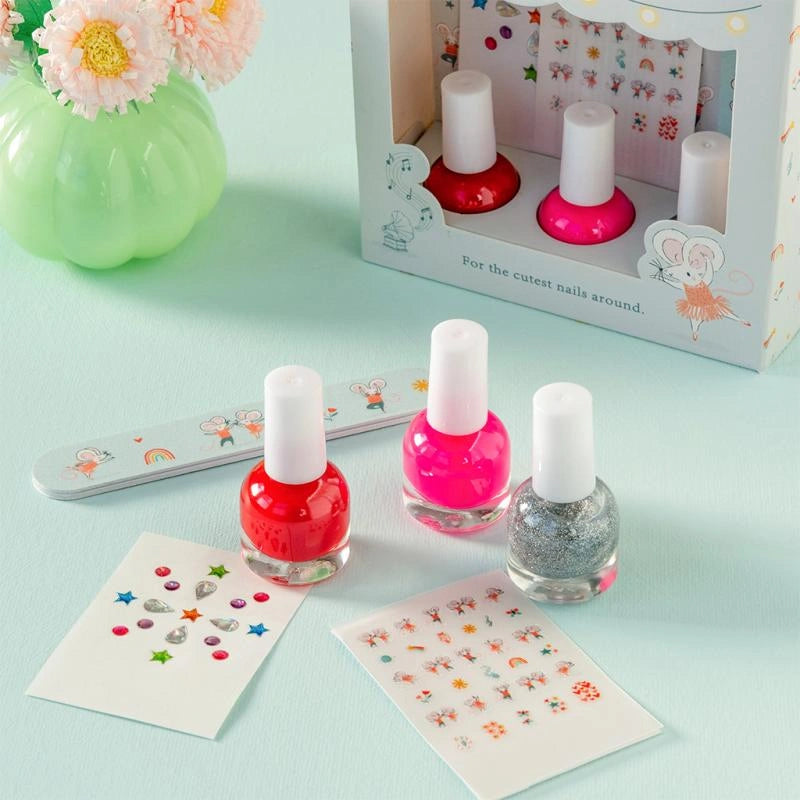 mimi and milo pastel nail kit for children. The box includes three colours of peel off nail polish - red, pink, silver glitter plus pastel nail tattoos, gems and an emery board. 