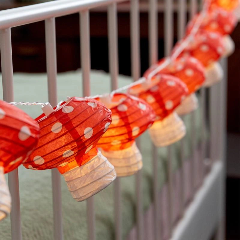 string of 10 LED mushroom lights attached to an outdoor railing 