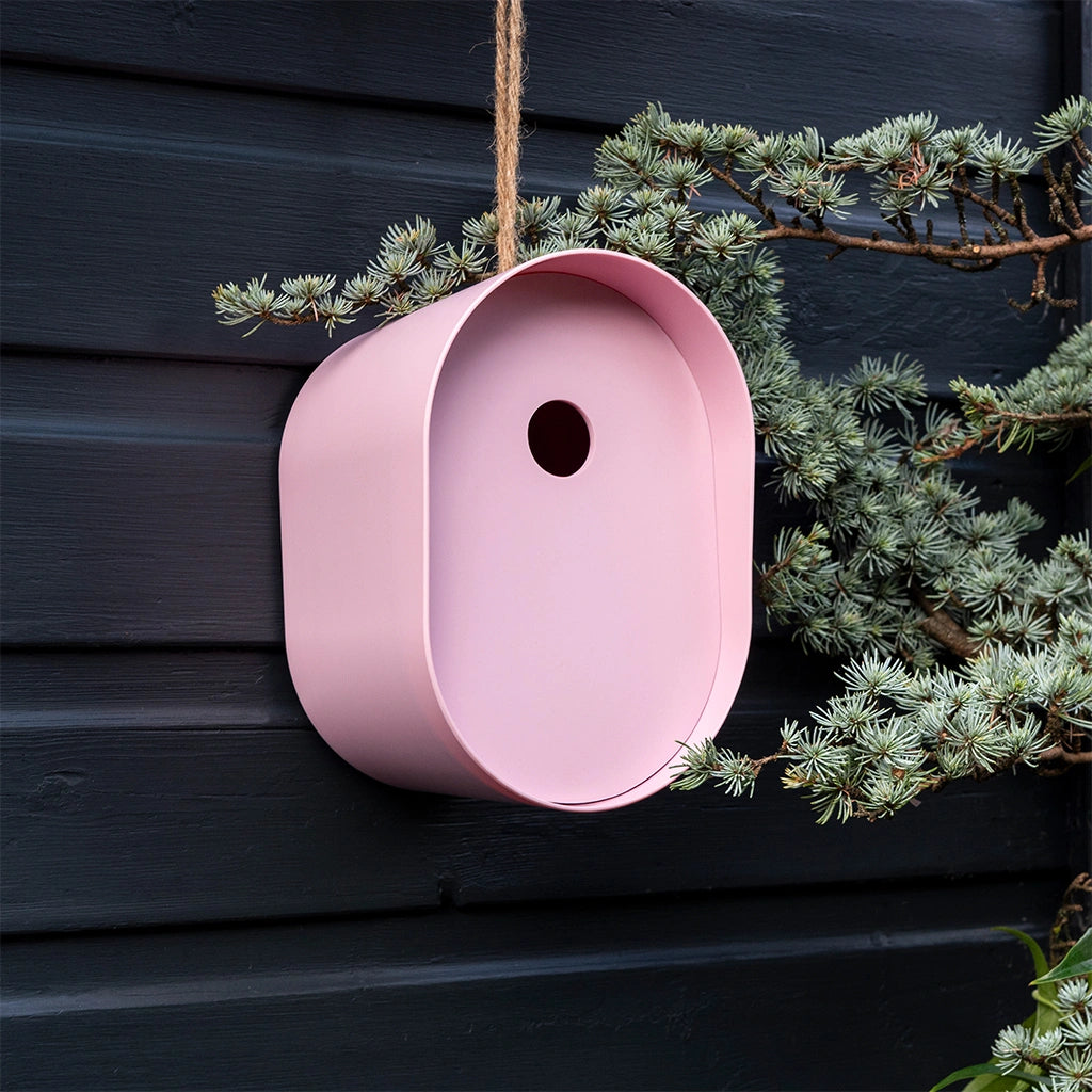 Rex London Oval Bamboo Bird House in a pastel pink. Modern and eco friendly garden decor